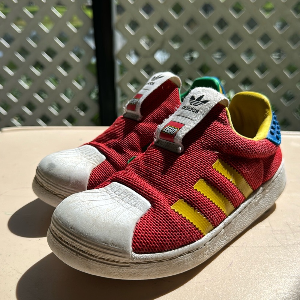 Limited edition multi color Superstar Lego Adidas slip-ons for boys